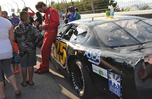 NASCAR Racer Danny Bopp shows off a United Hope for Animals Decal on his race car.